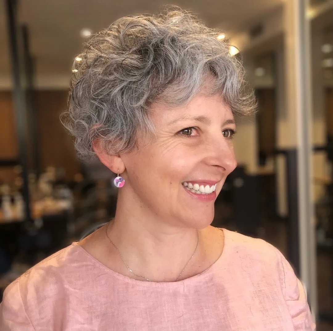 16-over-50-fun-gray-curly-pixie-hairstyle.webp