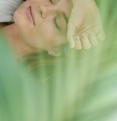 daydreaming-woman-and-blurred-house-plant.jpg