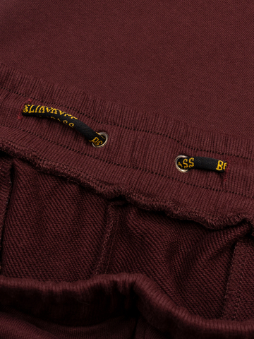 Спортивные штаны цвета красного вина с лампасами, без манжета. Плотный футер