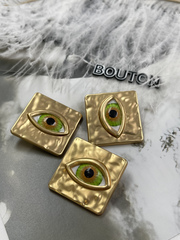Пуговицы золотистые квадратные Скиап. с объемным зеленым глазом