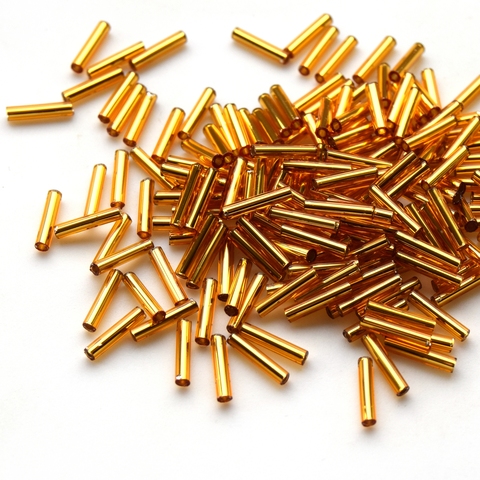 Стеклярус Тохо 9 мм 0022С темно золотистый