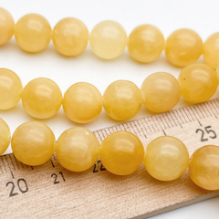 Кальцит желтый бусины, диаметр около 10,3-10,7 мм, цена за 18-19 шт (1/2 нити)