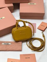 Мини сумка MIU MIU из натуральной кожи в горчичном цвете