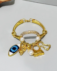 Браслет с подвесками в стиле Schiaparelli