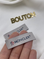 Бирка Монкл серого цвета