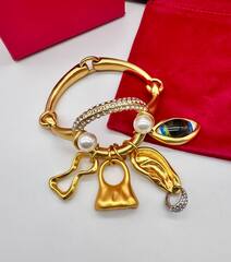 Браслет с подвесками в стиле Schiaparelli