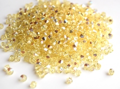 Биконусы 4мм Сваровски Jonquil AB