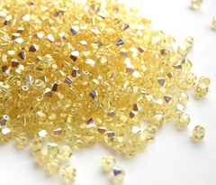 Биконусы 4мм Сваровски Jonquil AB