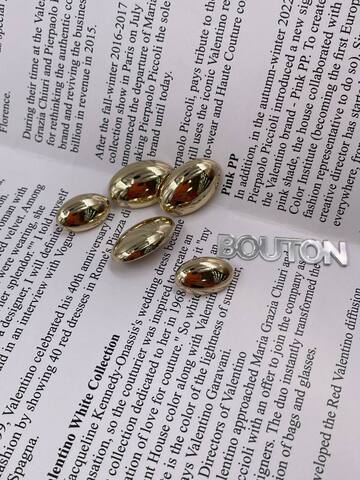 Пуговицы золотые овальные