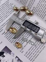 Пуговицы золотые овальные