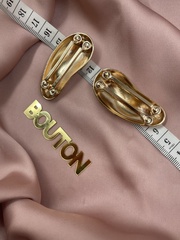 Пряжка-брошь неровной формы для купальника золотистая