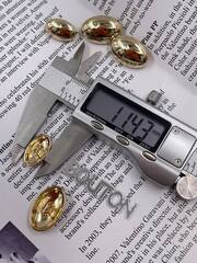 Пуговицы золотые овальные