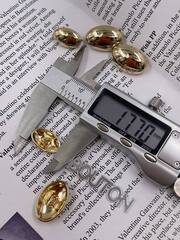 Пуговицы золотые овальные