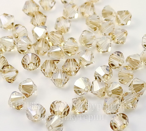 5328 Бусина - биконус Сваровски Crystal Golden Shadow 6 мм, 5 штук