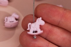 Бусина лошадка 14х8 мм розовая