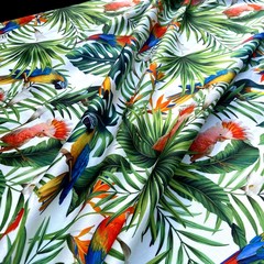 попугаи и листья  в хлопке  фото