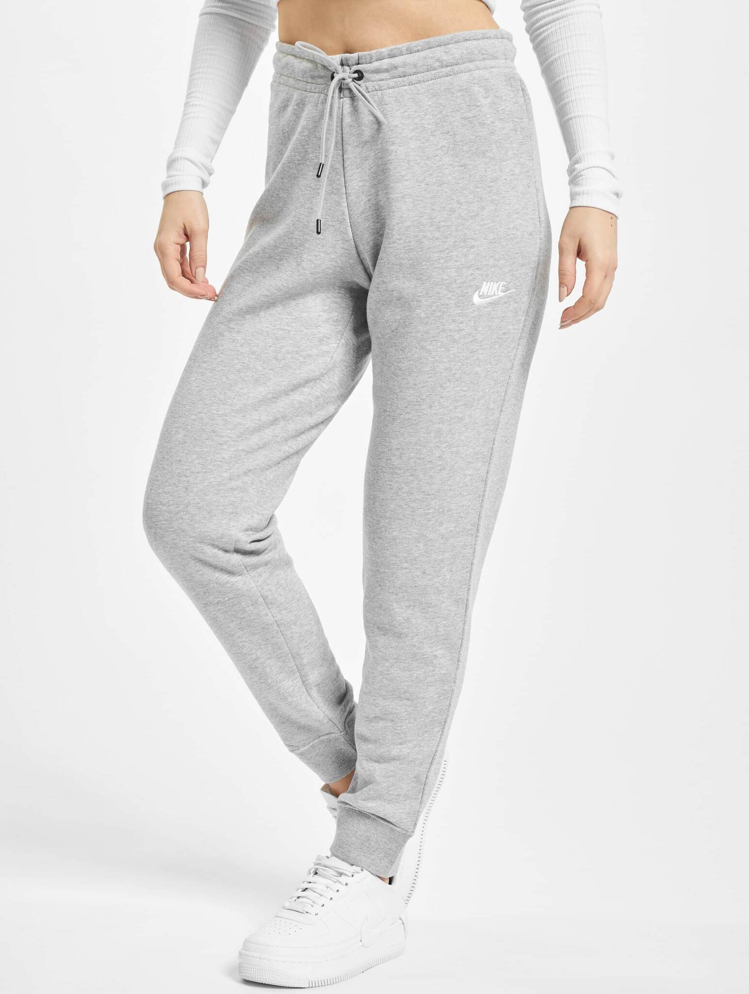 Спортивные брюки найк женские. Nike Essential брюки. Nike Essential брюки женские. Nike Basic Sweatpants Grey. All over Swoosh Joggers.