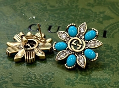 sergi-romashki-s-golubymi-rozovymi-vstavkami-cvet-bronza-gucci