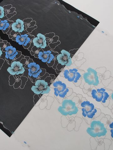 Вышивка на сетке светло-серая с синим и голубым ширина 22 см (2 стороны)