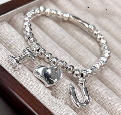 68127- Браслет UNOde 50 с подвесками