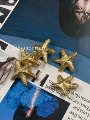 Пуговицы в форме морской звезды золотые матовые