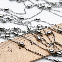 Цепочка, цвет серебро (родий), размер звена 1*1,5 мм, бусина 4,5*3 мм, цена за 50 см