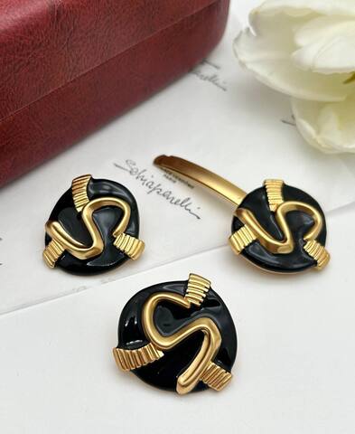 Серьги и заколка Schiaparelli