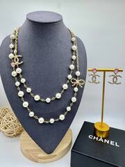 56175 - Колье CHANEL с жемчугом и бантом