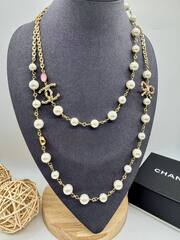 56175 - Колье CHANEL с жемчугом и бантом