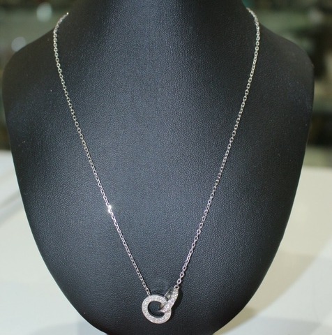 Колье Cartier Interlocking Love