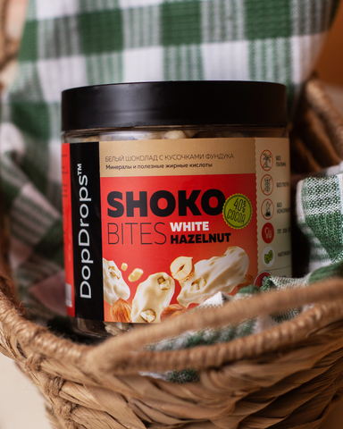 Белый шоколад с кусочками фундука “Шоко Байтс Вайт Хазельнат” (“Shoko Bites White Hazelnut”) 230г