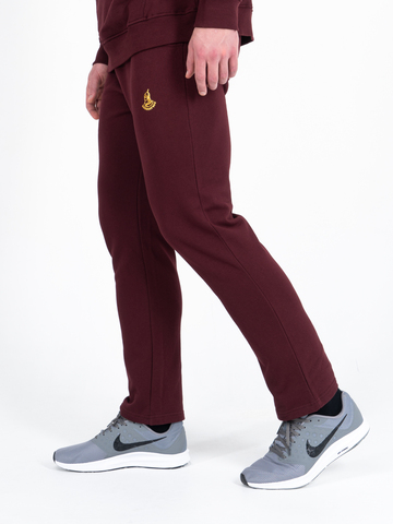 Спортивные штаны цвета красного вина без манжета, без лампасов. Плотный футер