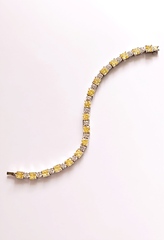 74992- Теннисный браслет из серебра с багетными бело-желтыми цирконами