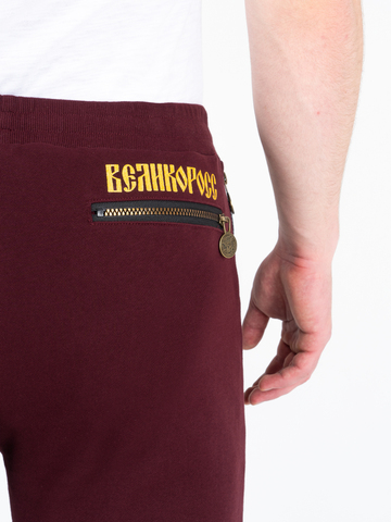Спортивные штаны цвета красного вина без манжета, без лампасов. Плотный футер