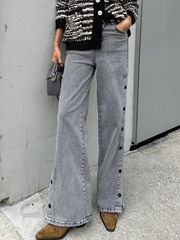 Джинсы с клепками по бокам