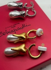 sergi-tooth-v-stile-schiaparell-s-podveskami-iz-zhemchuga