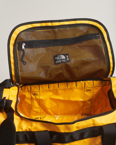 Картинка баул The North Face base camp duffel m Summit Gold-Black - 14