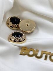 Пуговицы золотистые объемные с черным камнем и обрамлением в форме цветочков