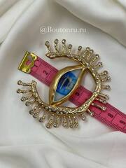 Брошь Скиап. золотистая в форме глаза с подковой из ресниц со стразами