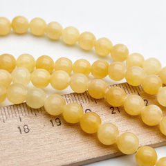 Кальцит желтый бусины, размер около 6,5-6,7 мм, цена за 28-29 шт (1/2 нити)