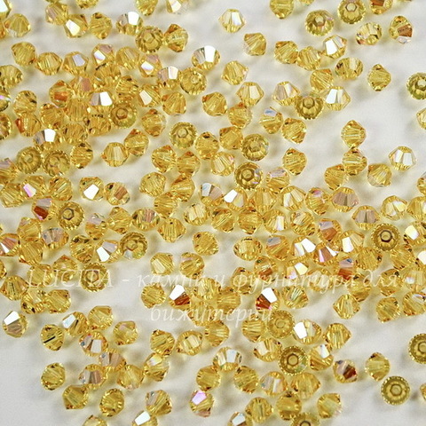 5328 Бусина - биконус Сваровски Light Topaz Shimmer 3 мм, 10 штук