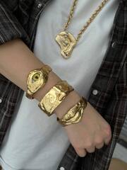 Комлект из трёх жёстких браслетов Schiaparelli