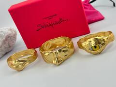 Комлект из трёх жёстких браслетов Schiaparelli