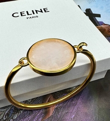 20155- Браслет Celine жесткий двухсторонний с круглой подвеской из латуни в позолоте, lux