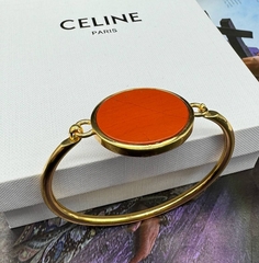 20155- Браслет Celine жесткий двухсторонний с круглой подвеской из латуни в позолоте, lux