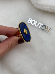 Кольцо золотистое с перламутровой синей овальной вставкой (безразмерное)