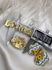 Пуговицы со стразами Скиап. золотистые в форме глаза с белой и бирюзовой эмалью