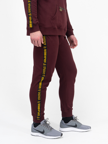 Спортивные штаны цвета красного вина с манжетами, с лампасами. Плотный футер