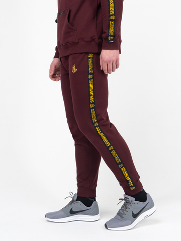 Спортивные штаны цвета красного вина с манжетами, с лампасами. Плотный футер