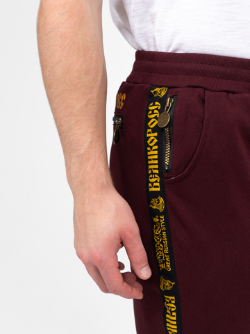 Спортивные штаны цвета красного вина с манжетами, с лампасами. Плотный футер